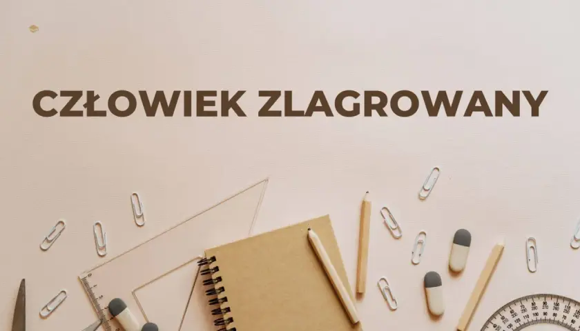Człowiek zlagrowany, ofiara systemu, otoczony przyborami szkolnymi.